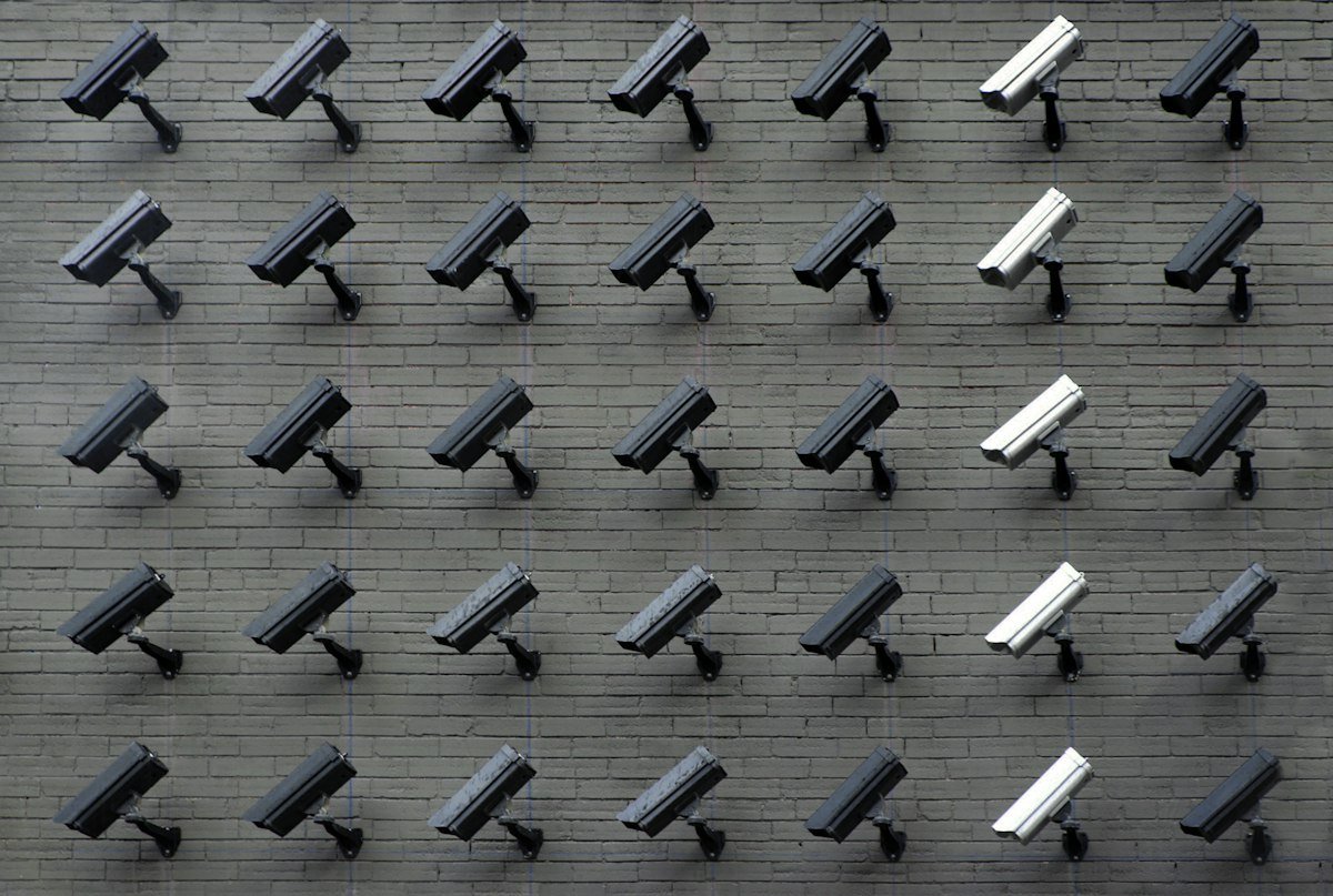 Security camera mounted outdoors at dusk